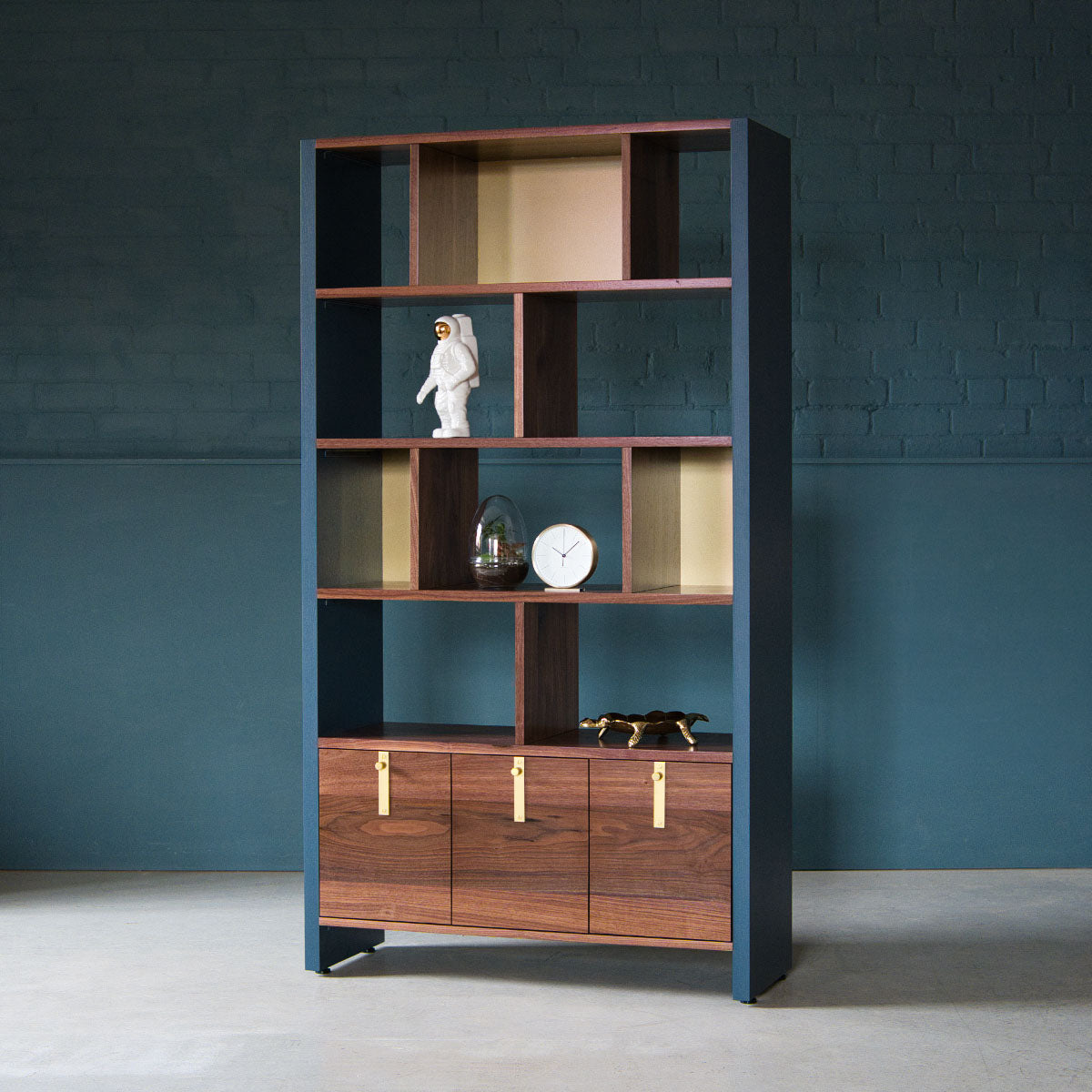 An image of the Walnut Bookcase, Aeris product available from Koda Studios